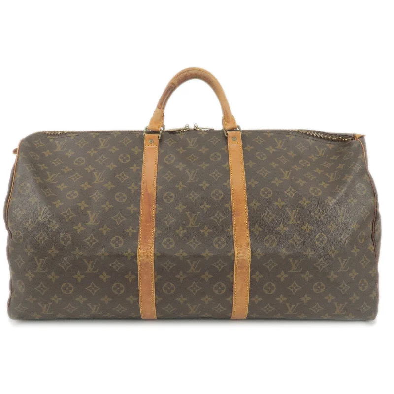 Louis Vuitton bags with a snap - button closure and a decorative charm for styleLouis Vuitton Monogram Keep All 60 Boston Bag M41422