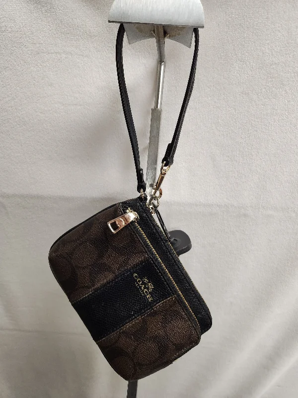 Coach Borough bags with a contrast - stitched handle for a unique lookWristlet Designer By Coach  Size: Small