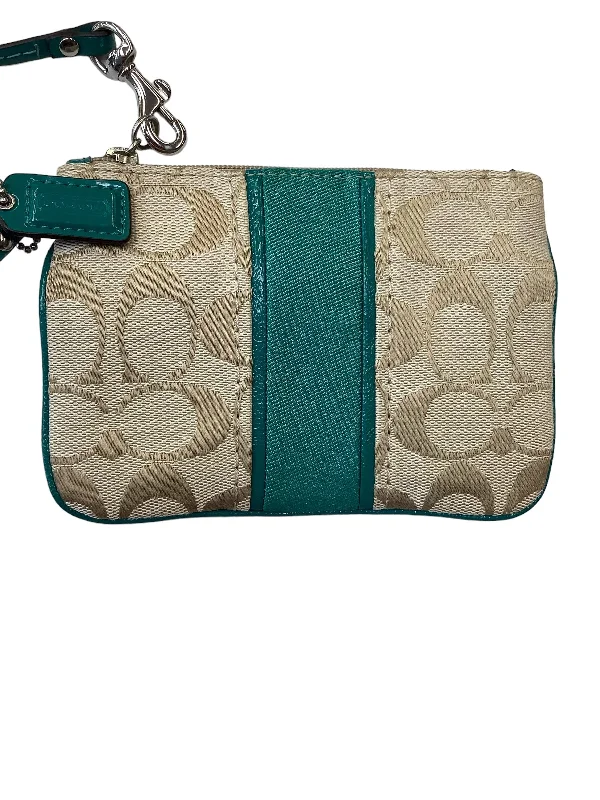 Coach Dempsey bags with a contrast - colored interior for visual interestWristlet Designer By Coach  Size: Small