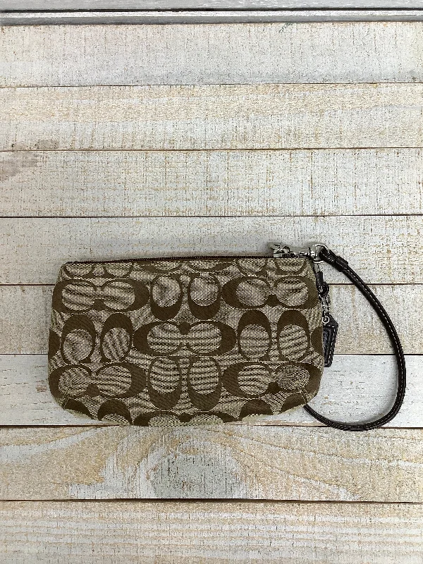 Coach Dempsey bags with a contrast - colored interior for visual interestWristlet Designer By Coach  Size: Medium