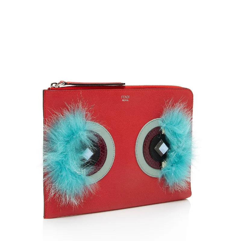 Fendi crossbody bags in a vibrant, neon color for a bold fashion statementFendi Leather Monster Zip Clutch (SHF-1L3C25)