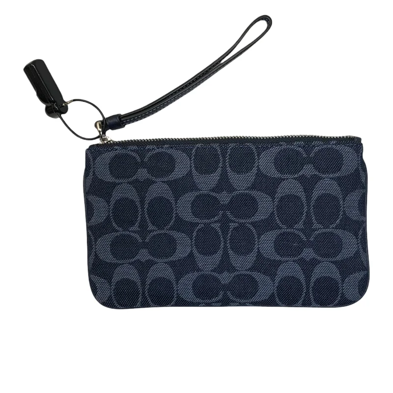 Coach Dempsey bags with a contrast - colored interior for visual interestWristlet Designer By Coach  Size: Medium