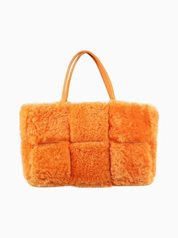 Hermes Bags with Adjustable and Padded Shoulder StrapsOrange faux-fur tote bag